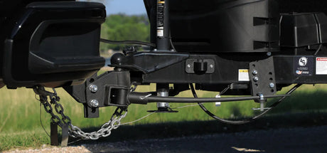 BXW0851 Blue Ox Trackpro weight distribution hitch with 800 lb capacity and 9-hole shank mounted on a vehicle, showcasing superior stability and control for towing.