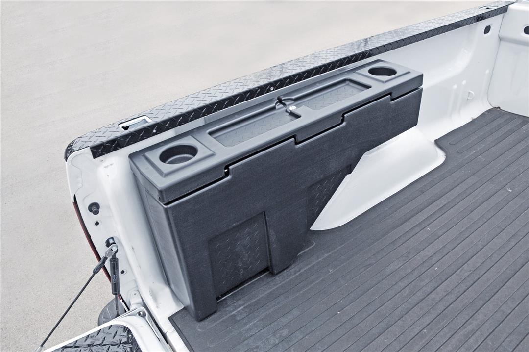 Tool Box Wheel Well; Single Reversible Lid; Black; Polyethylene; 37 Inch Top Length/ 14 Inch Bottom Length x 7.75 Inch Width x 19.5 Inch Rear Height/ 8.5 Inch Front Height; 2.2 Cubic Foot Capacity; Mounts On Either Side Of Bed; "Because of different style