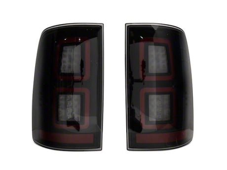 Raxiom 09-18 Dodge RAM 1500 LED Tail Lights with Black Housing and Smoked Lens.